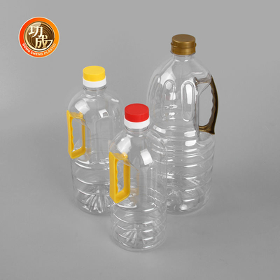L'olio di girasole del commestibile 1 litro imbottiglia la chiara bottiglia di plastica dell'all'aceto con la maniglia